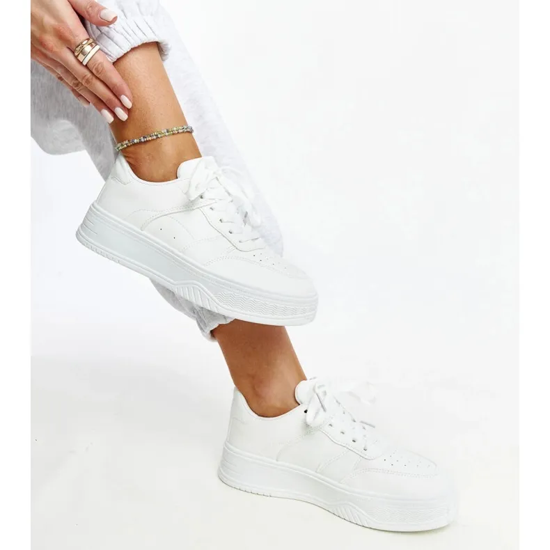 White sneakers with a thick sole from Rafida