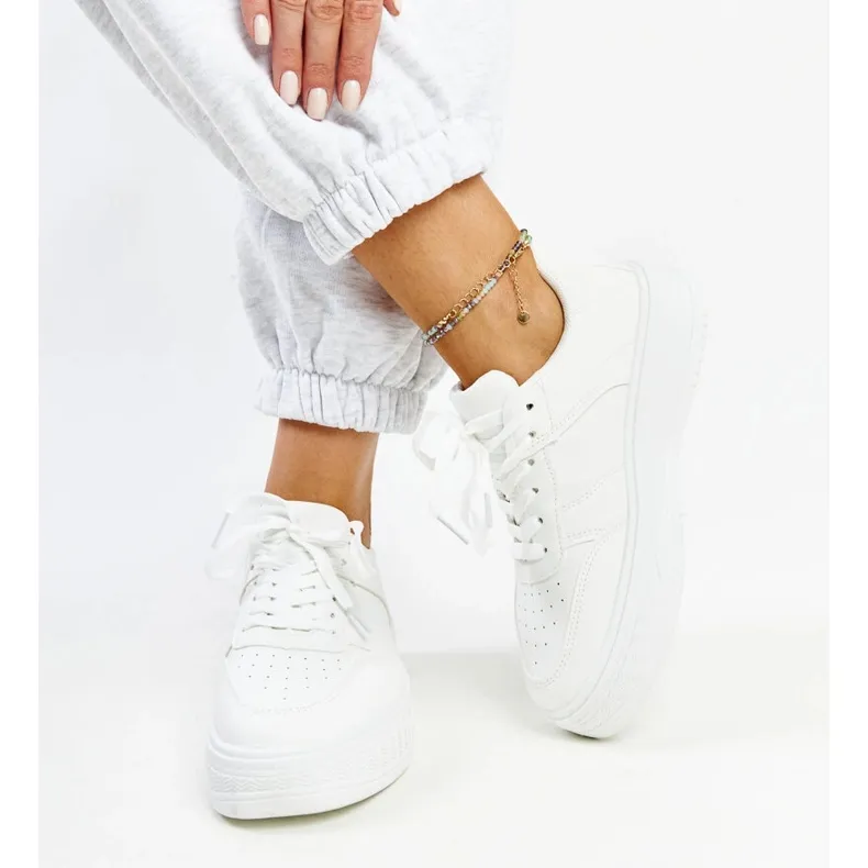 White sneakers with a thick sole from Rafida